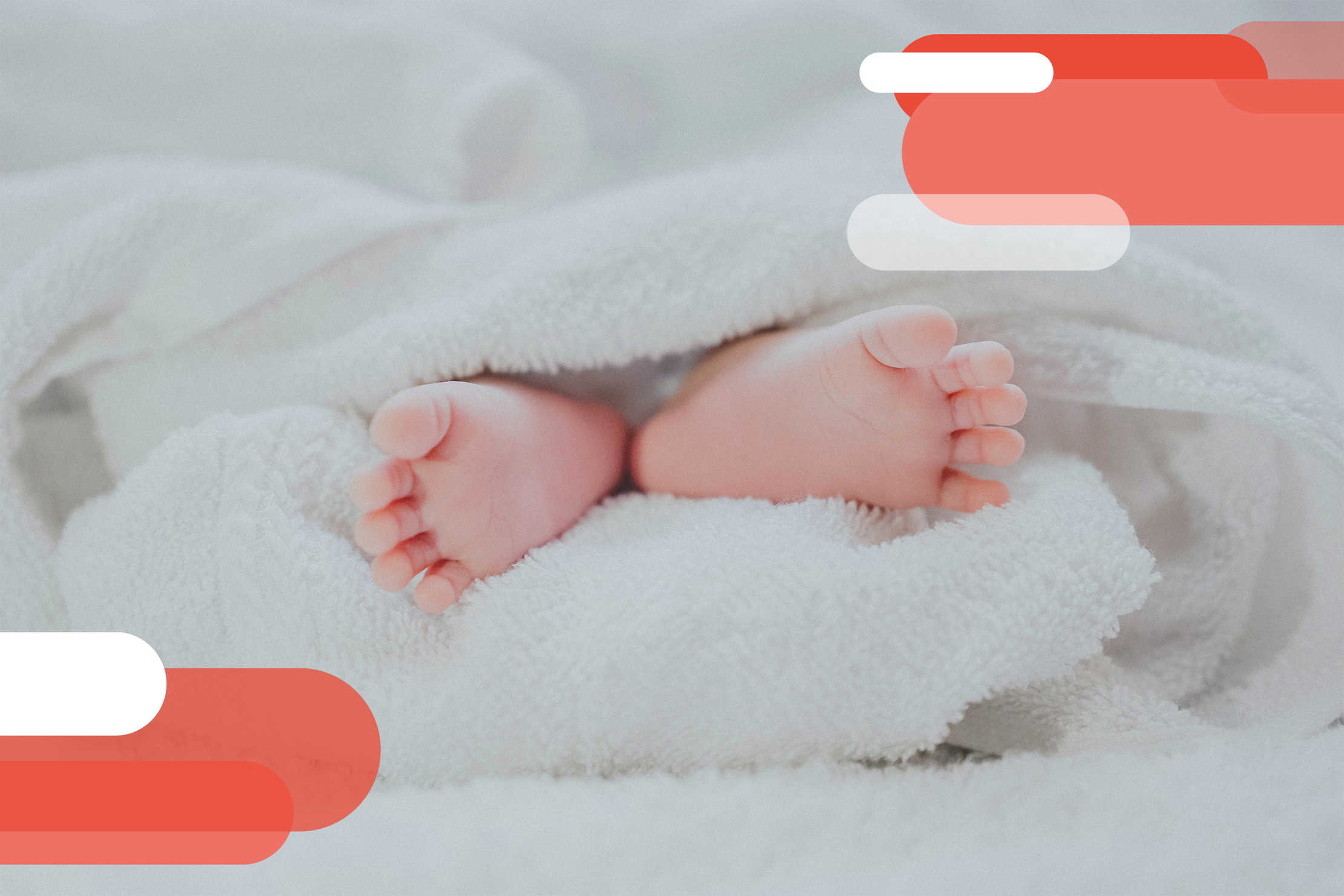 A baby’s feet wrapped in a white towel